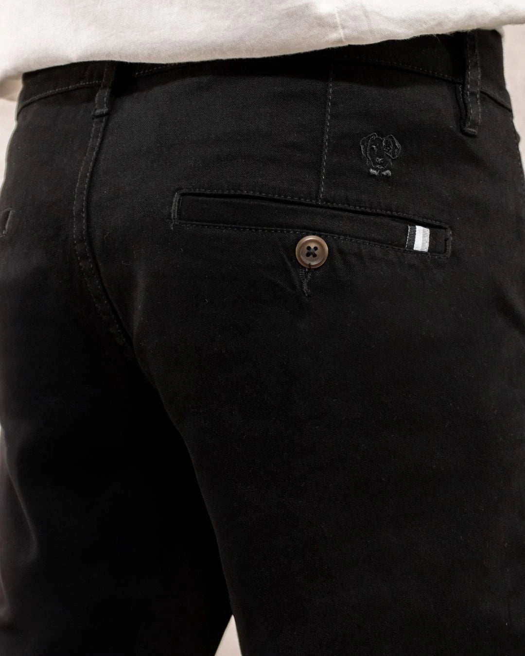 Close-up photo of men's black -colored stretch chino pants by DANTE.