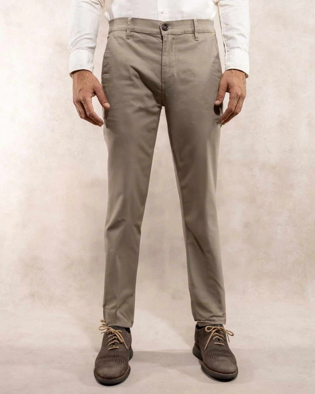 Model photo of men's beige stretch chino pants by DANTE.