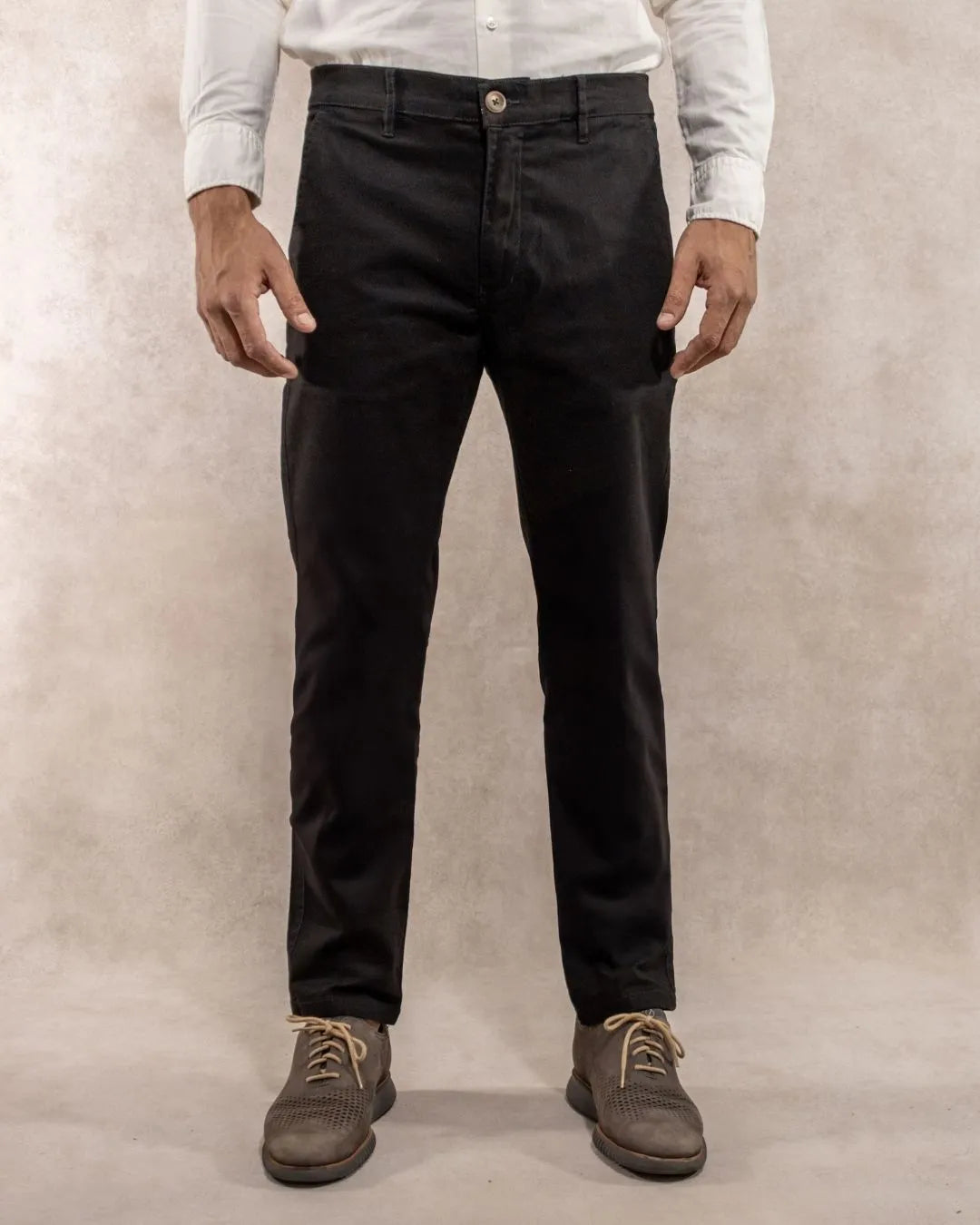Model photo of men's black stretch chino pants by DANTE.